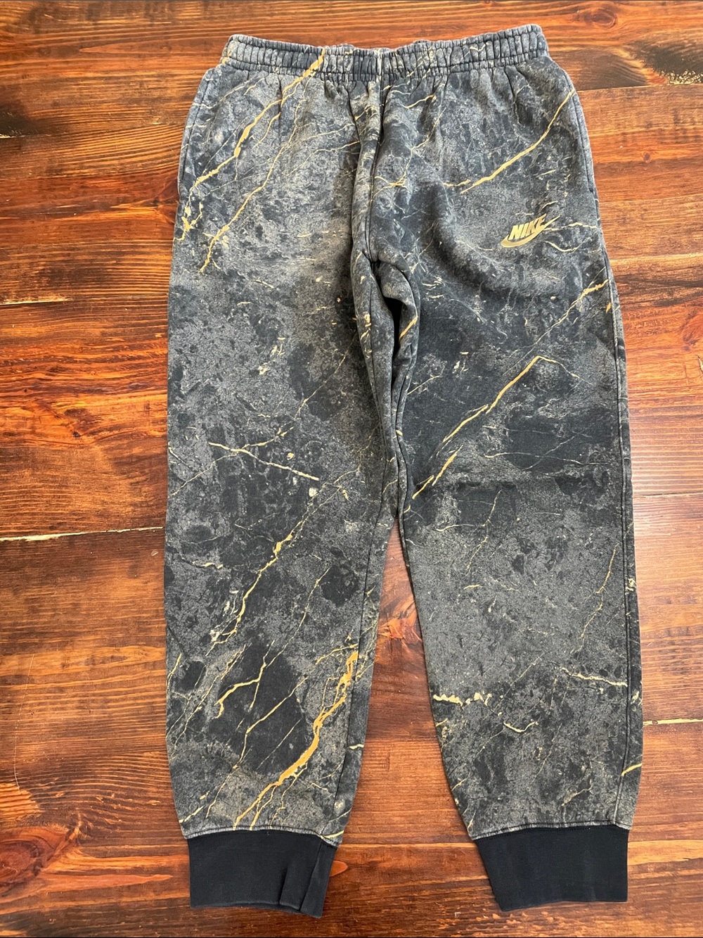 Nike Black Joggers with Gold Veining Accent